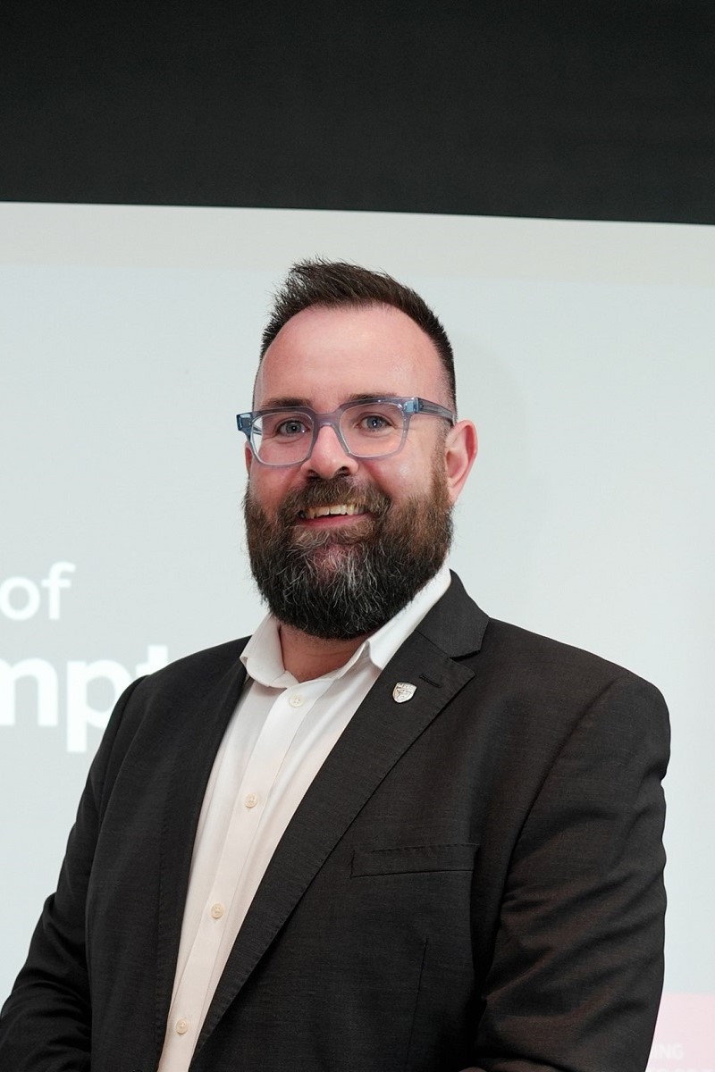 A headshot of David Winstanley