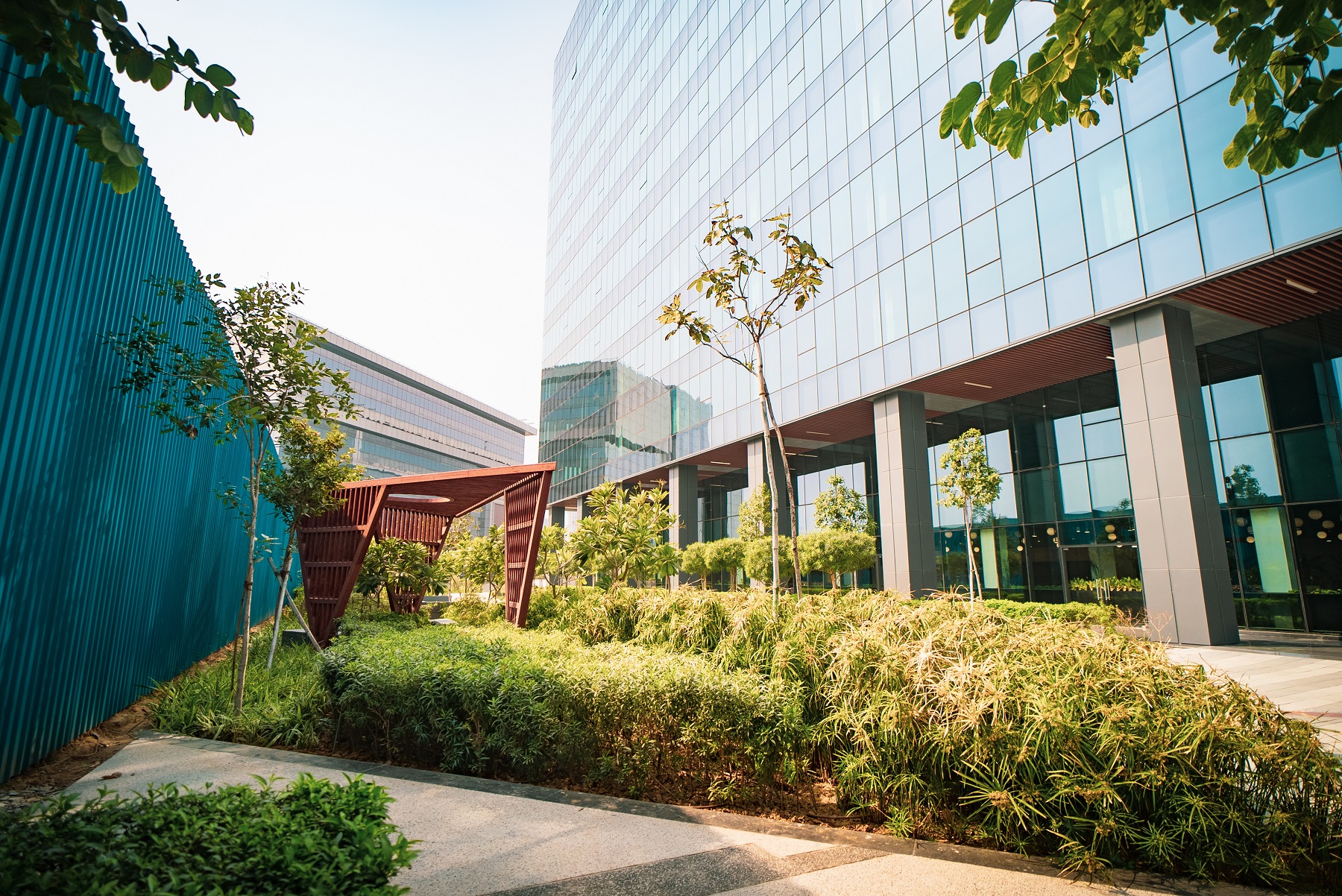 A well manicured outside garden complete with geometric trellis and planting